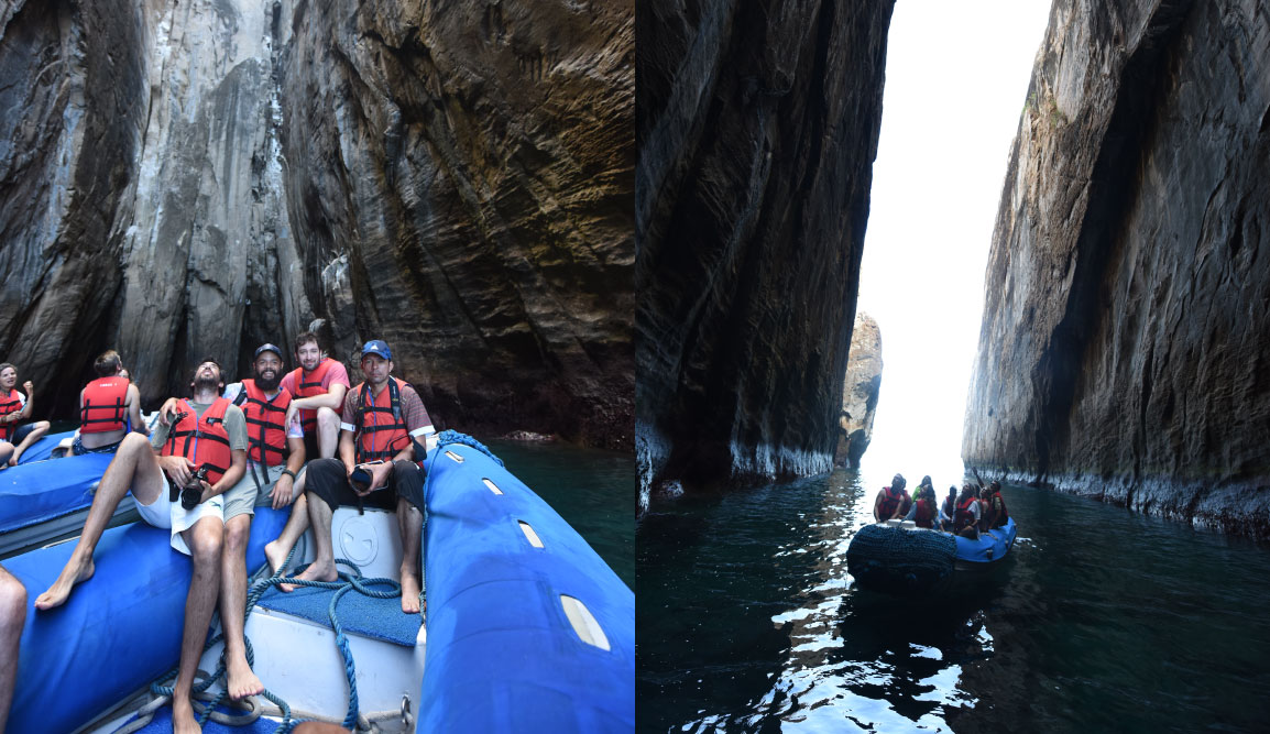 Cerro Brujo - San Cristobal in Galapagos Islands, rock formations with Kicker rock at background and tourist in panga