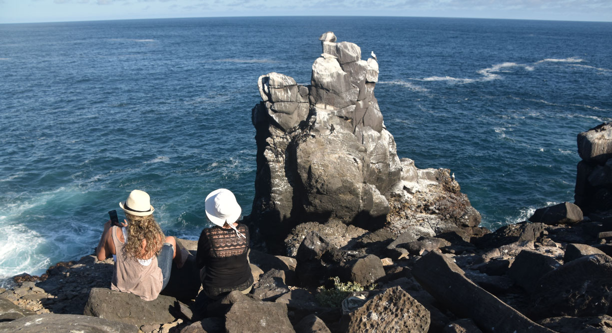 Suarez Point - Española in Galapagos Island, tourist looking the sea