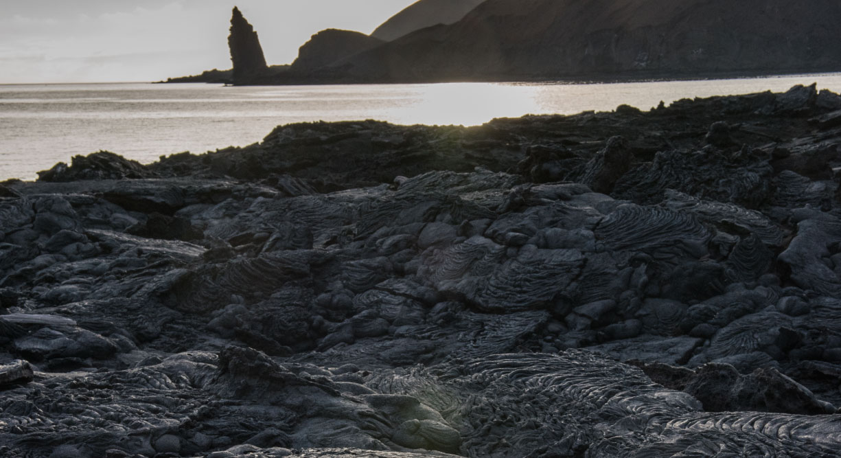 Sullivan bay in Santiago Island, solid lava with backgroud of the bartolome island