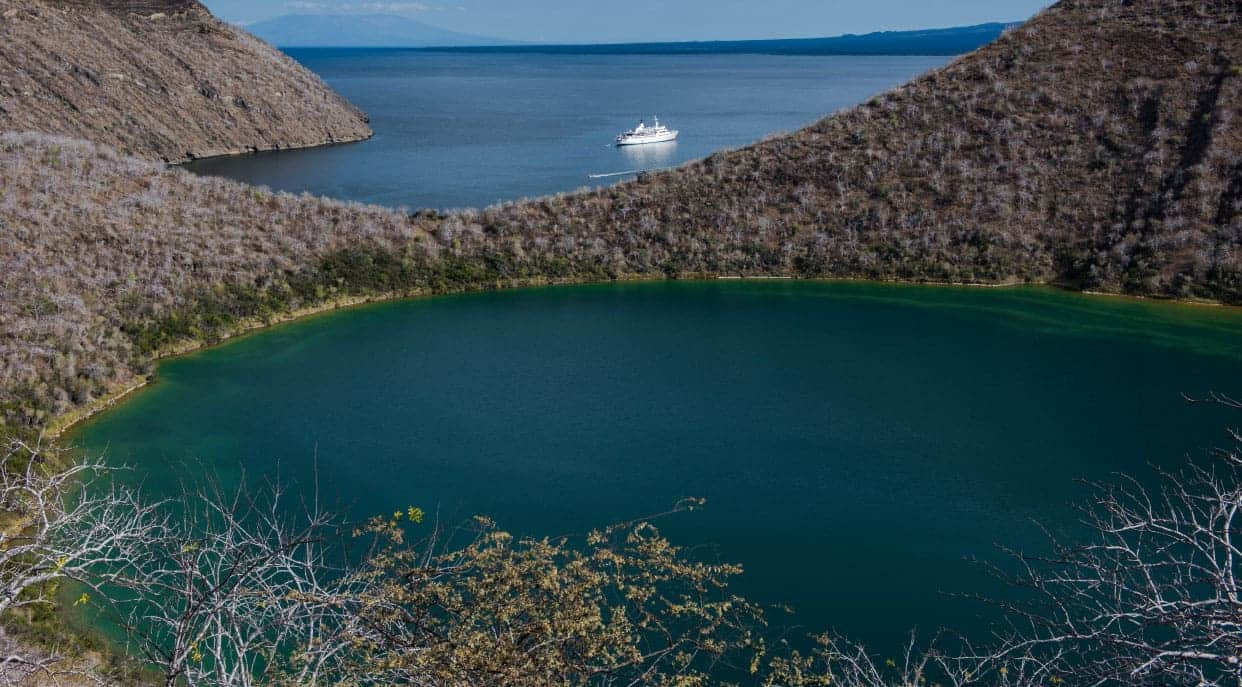 Tagus Cove - Isabela in the Galapagos, view of the Galapagos Legend in the sea over the horizon