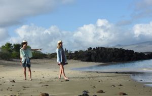 Cerro brujo in San Cristobal Legend Itinerary C, view of a girls in a beach.